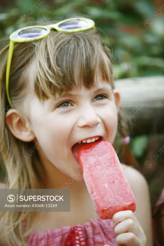 A Scandinavian girl eating an ice cream, USA.