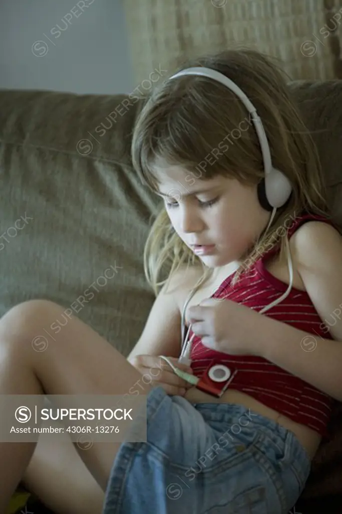A Scandinavian girl using an iPod, Brazil.