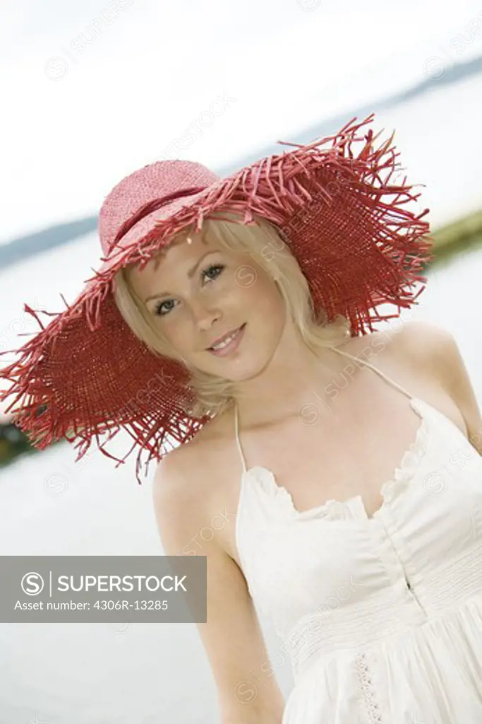 A woman wearing a red hat, Sweden.