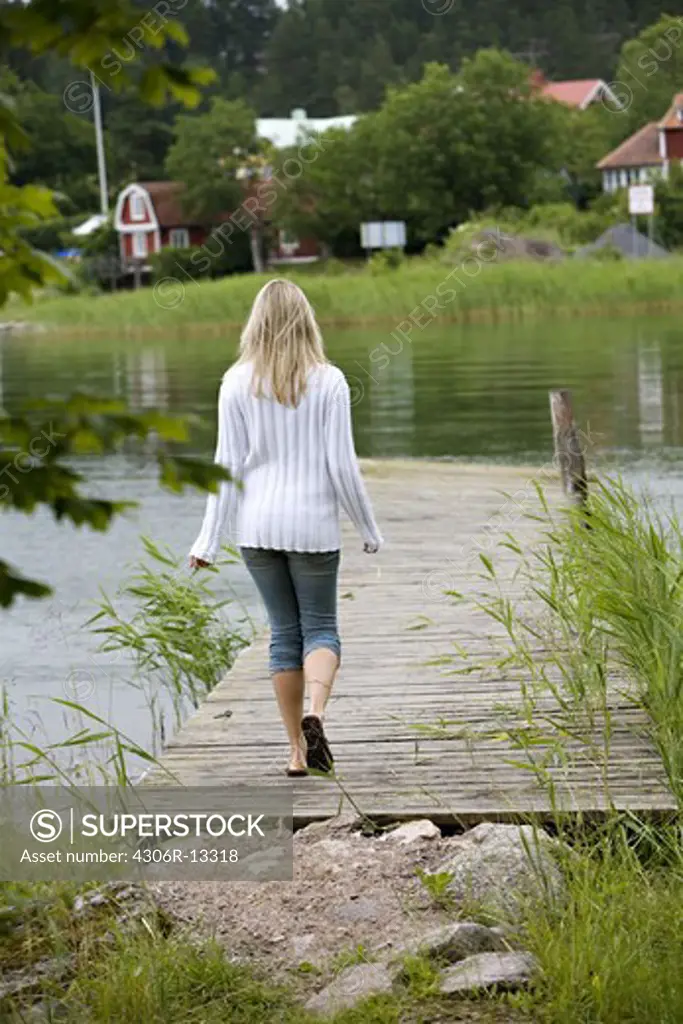 A woman walking in Stockholm archipelago, Sweden.