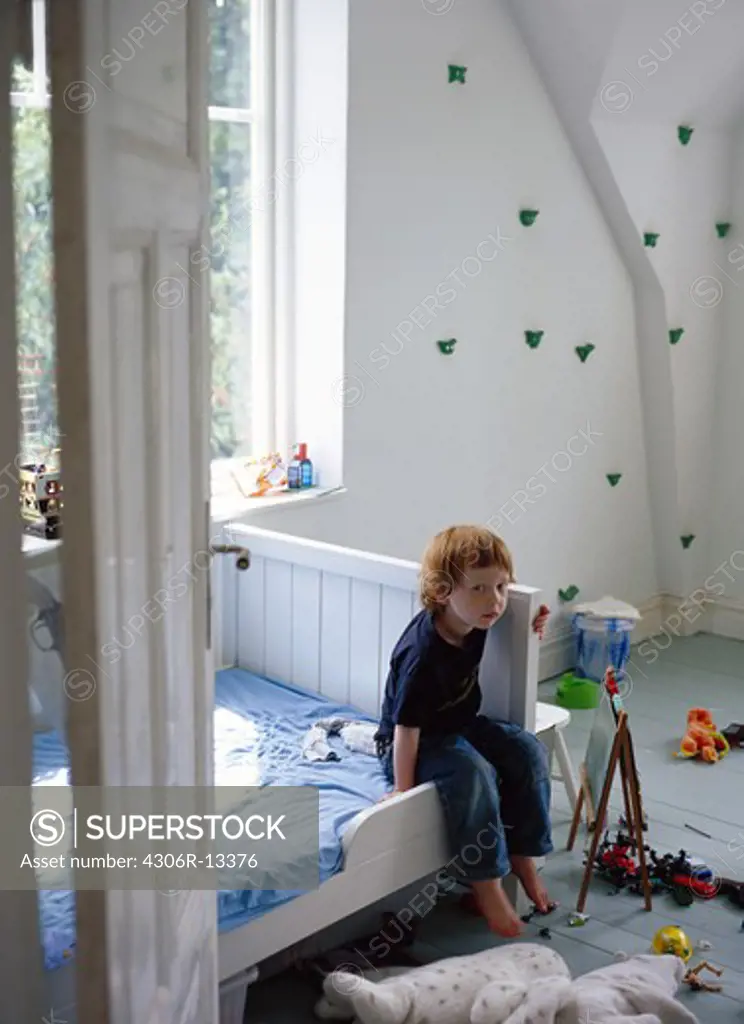 A boy sitting in his room, Sweden.