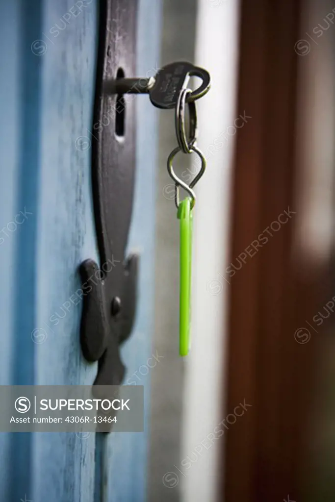 A key in a door on a summerhouse, Sweden.
