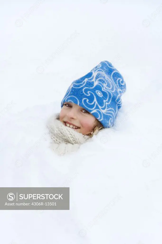 A girl playing in the snow, Sweden.