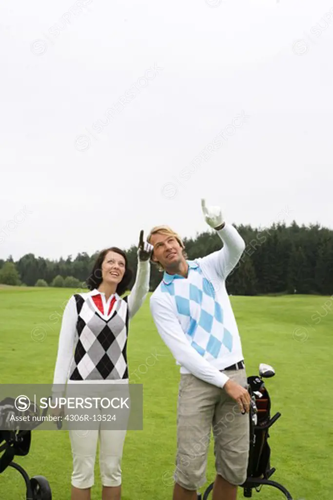 A young couple playing   golf, Sweden.
