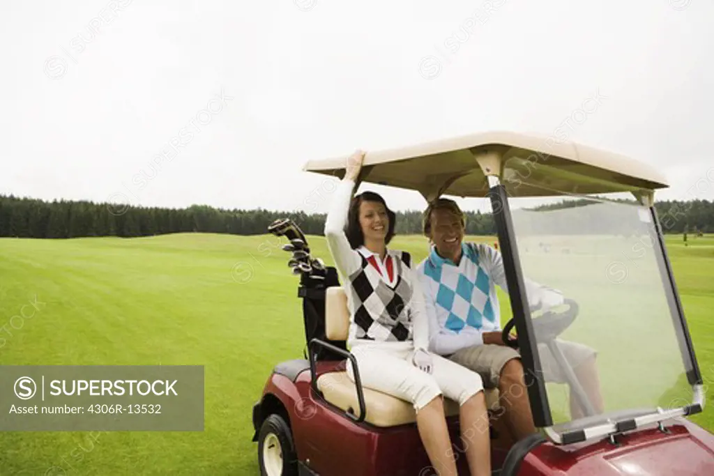 A young couple playing   golf, Sweden.