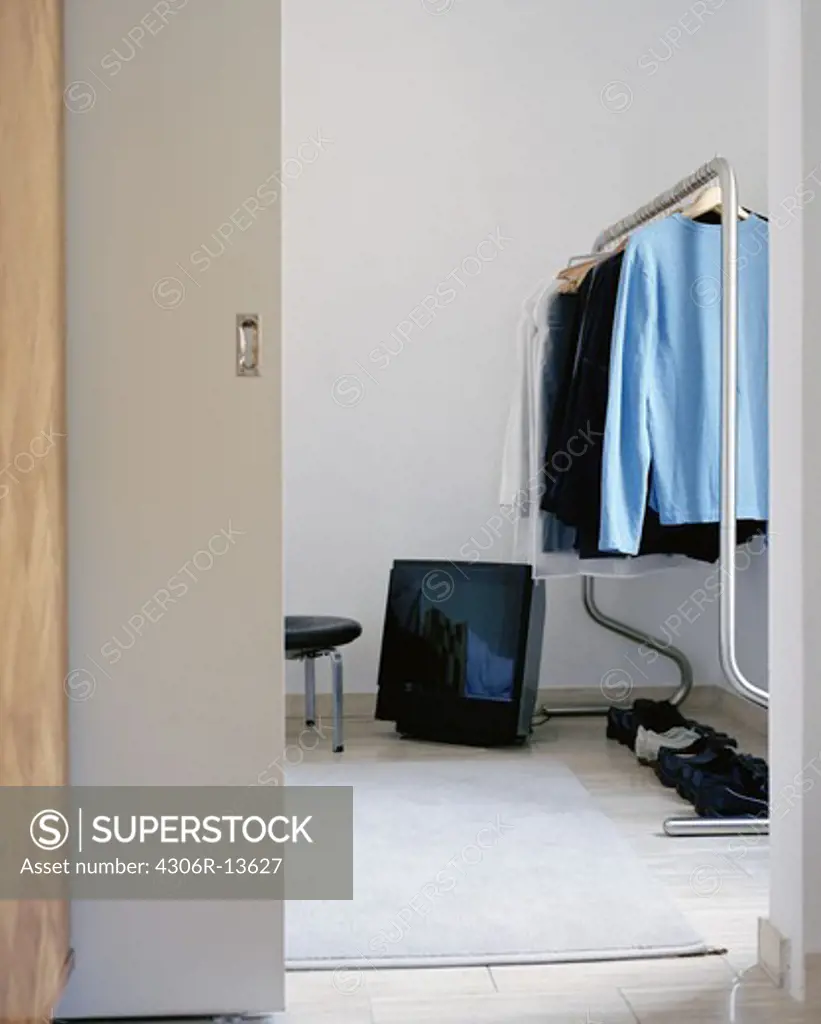 A television on the floor in a bedroom, Sweden.