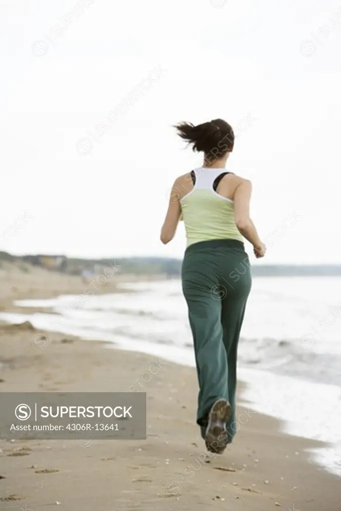 A woman jogging, Skane, Sweden.