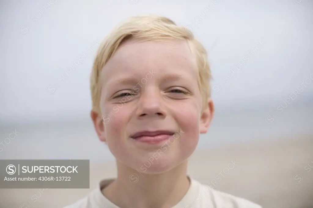 A blond boy on a beach, Sweden.