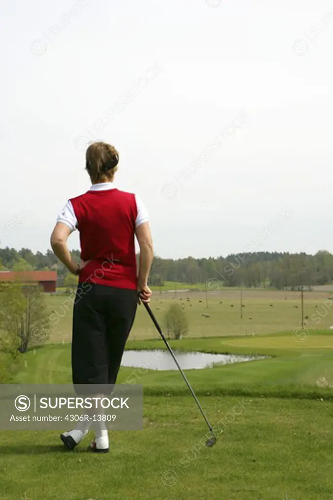 A woman playing golf, Sweden.