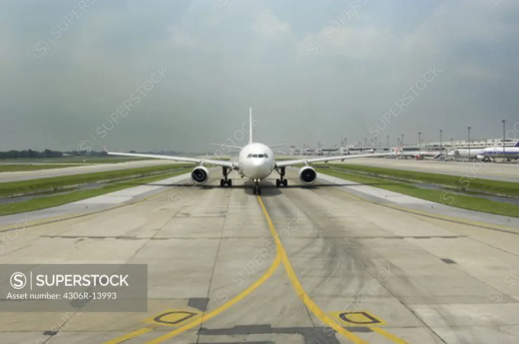 An aeroplane on a runway, Bangkok, Thailand.