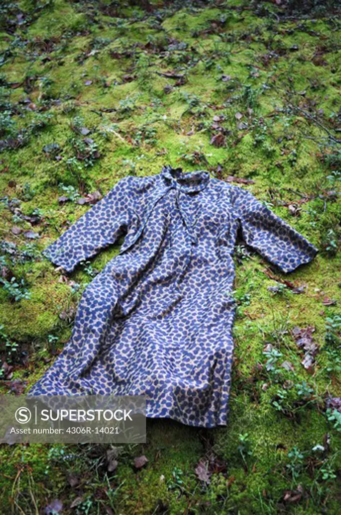 A dress thrown on green moss, Sweden.