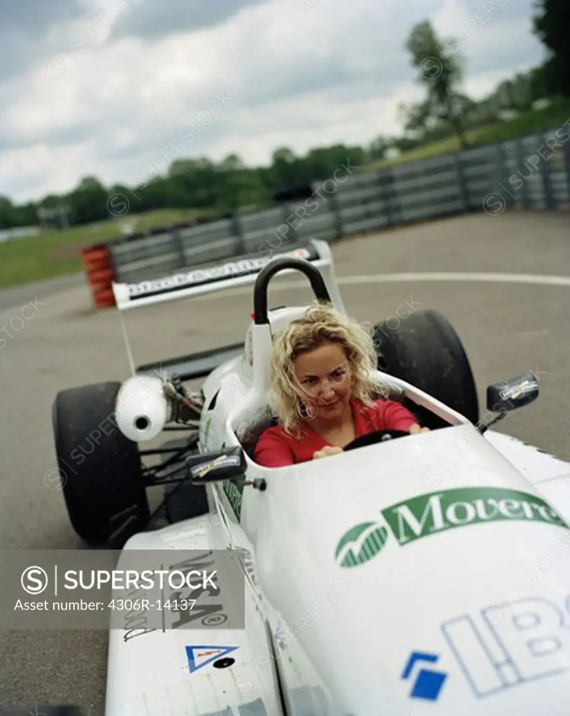 A woman in a racing car, Astorp, Sweden.