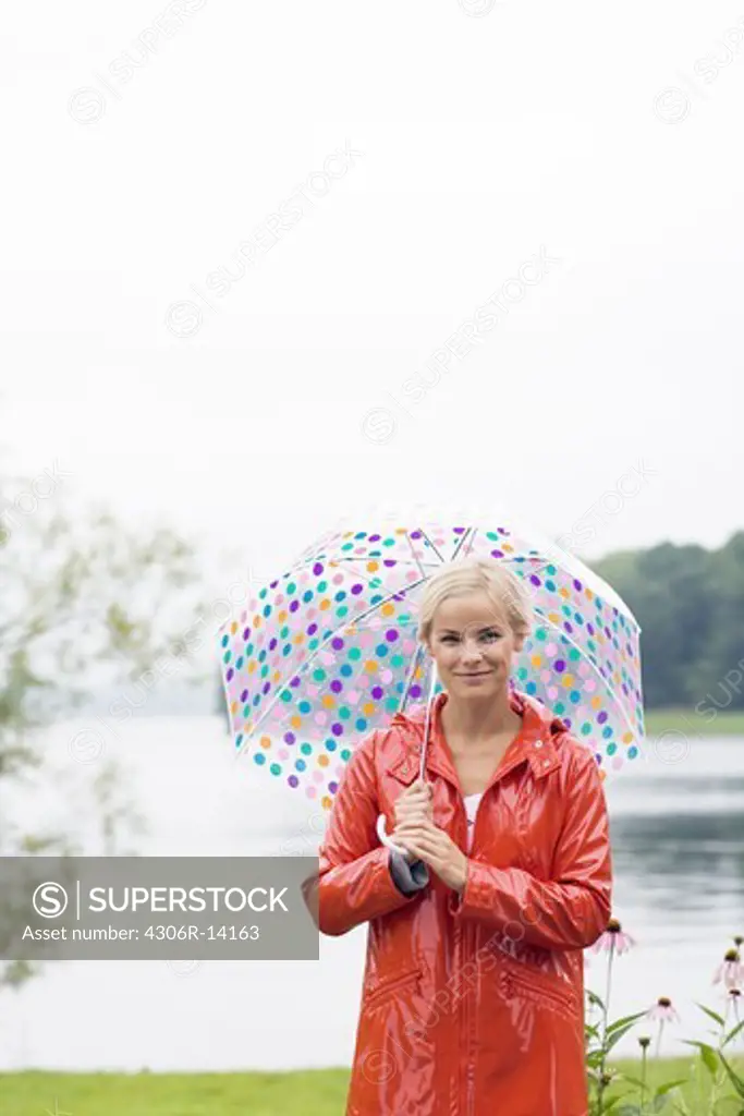 A woman with a dotted umbrella, Sweden.