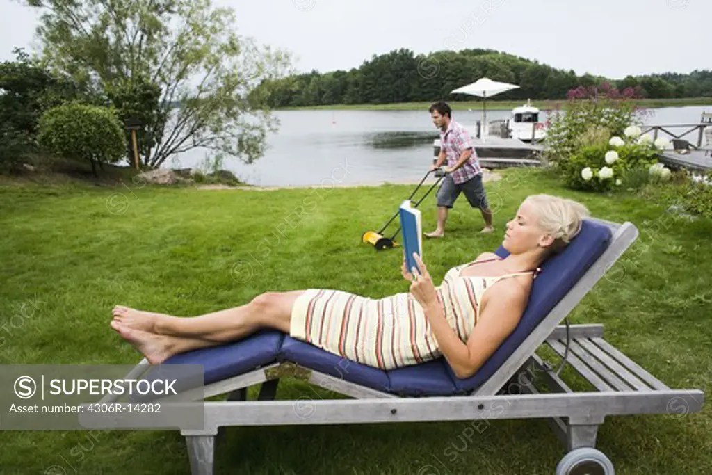 A woman sitting in a sun chair, Sweden.