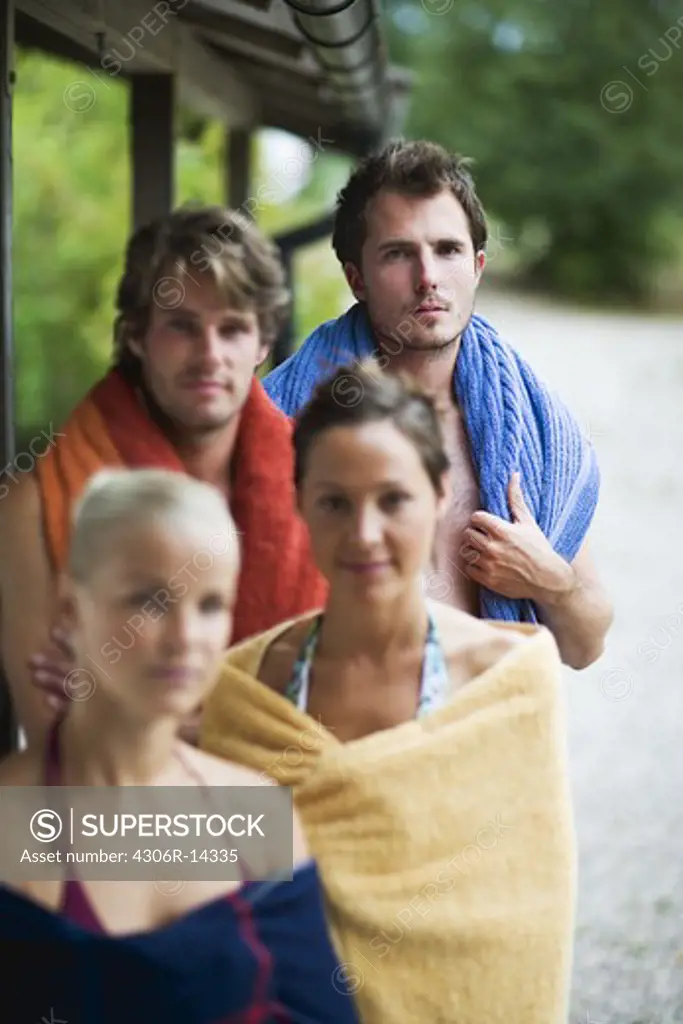 Four people with towels, Sweden.