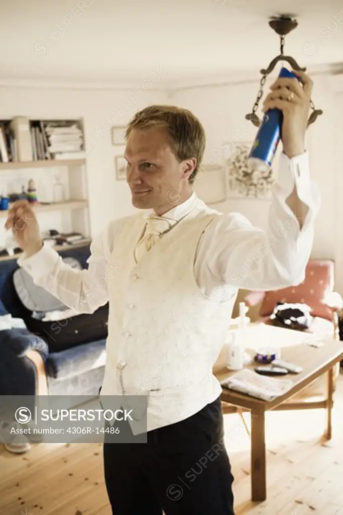 A bridegroom doing his hair, Sweden.