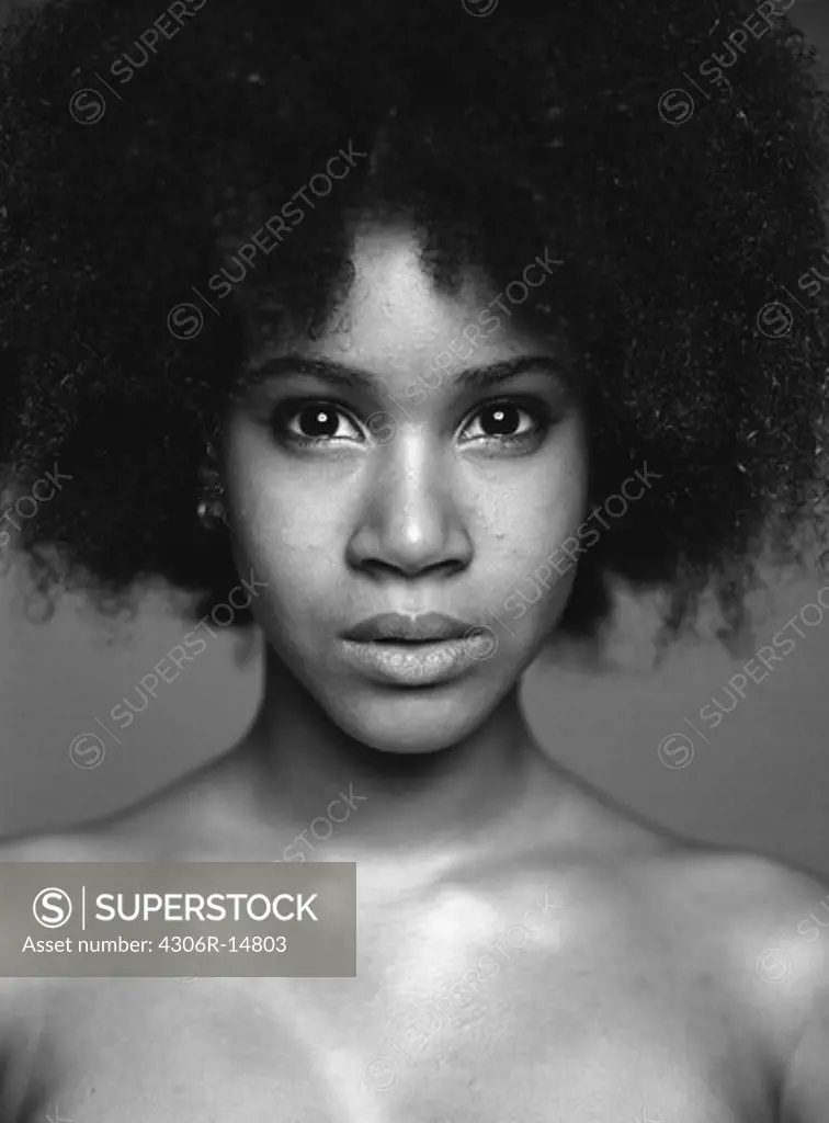Portrait of a young woman with afro hairstyle.