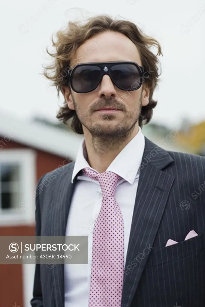 A man in a suit on the countyside, Sweden.