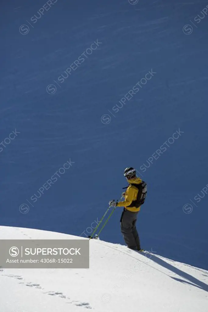 Skier in action, downhill.