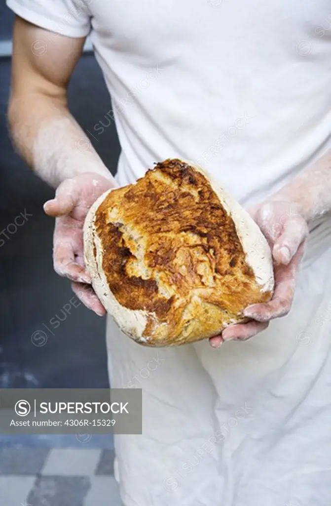 A baker in a bakery, Sweden.
