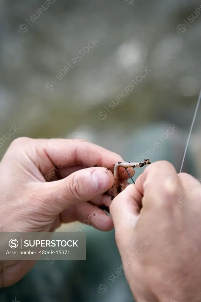A man with an entangeled  fishing-line, close-up.