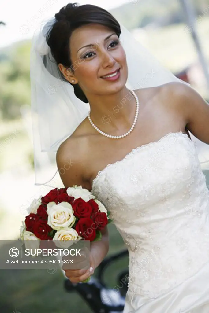 A bride holding her wedding bouquet, Sweden.