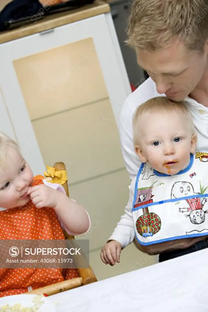 Two babies wearing bib, Sweden.