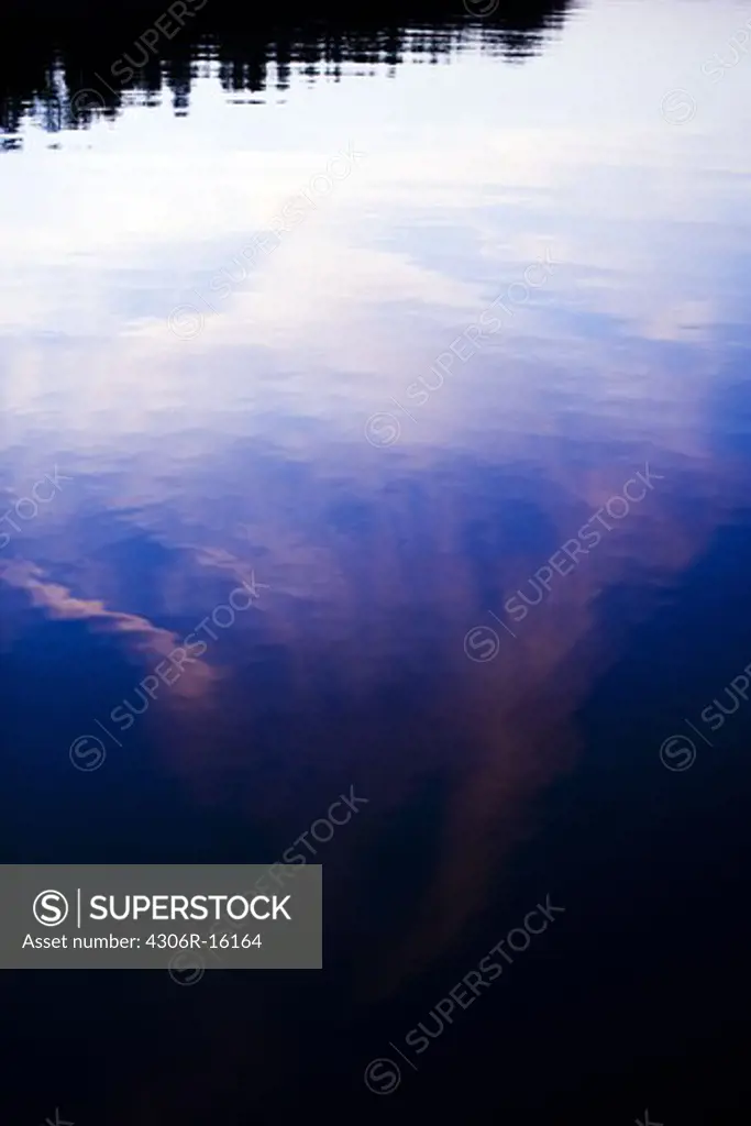 The reflection of the sky in the water.