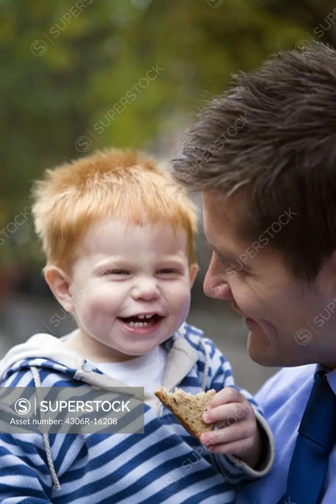Smiling father with son, Sweden.