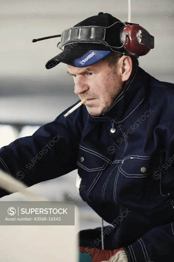 A building worker at a building site, Sweden.