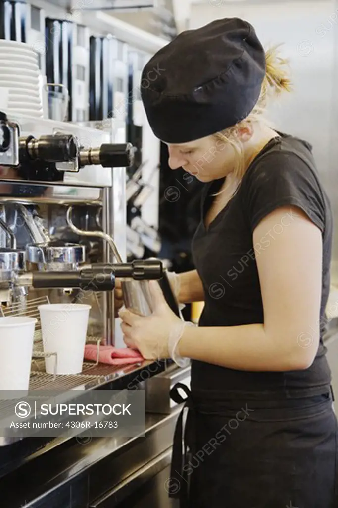A woman working in a cafe, Sweden.