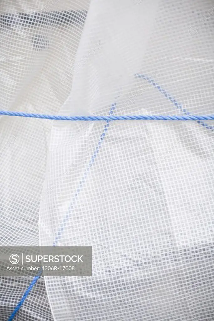 A tarpaulin and a blue rope, Sweden.