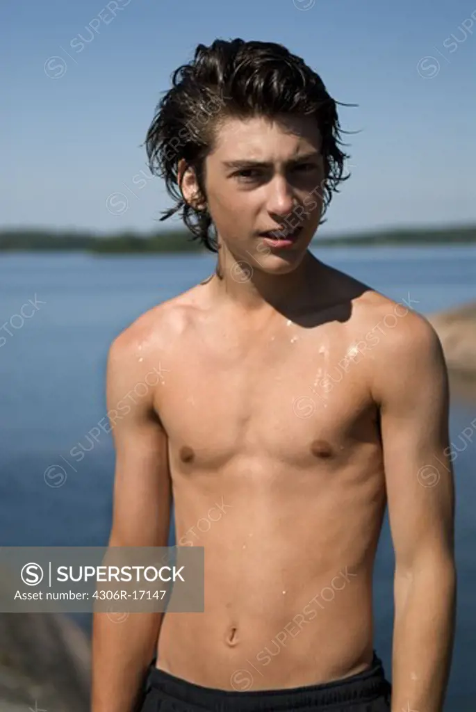A teenage boy by the sea, Sweden.