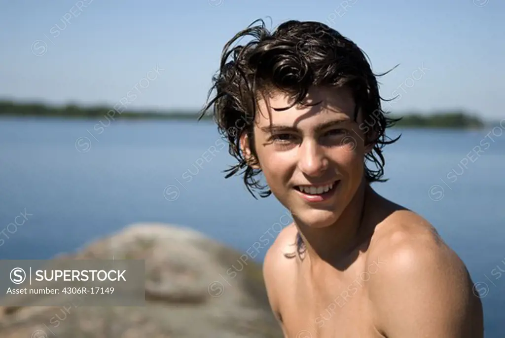 Portrait of a teenage boy by the sea, Sweden.