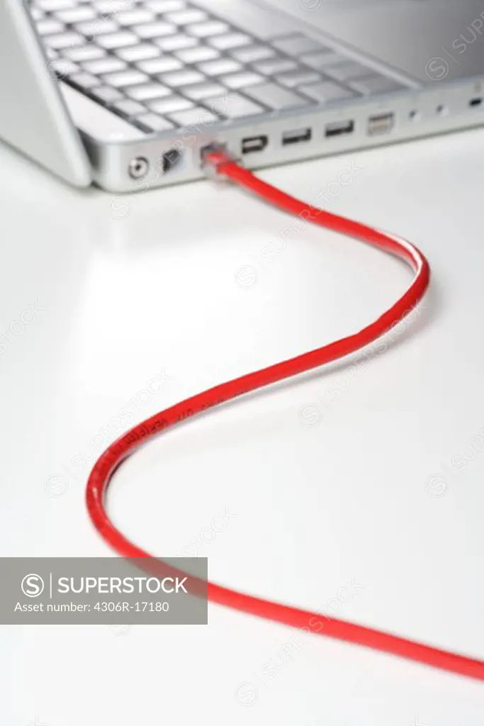 A computer with an internet cable, close-up.