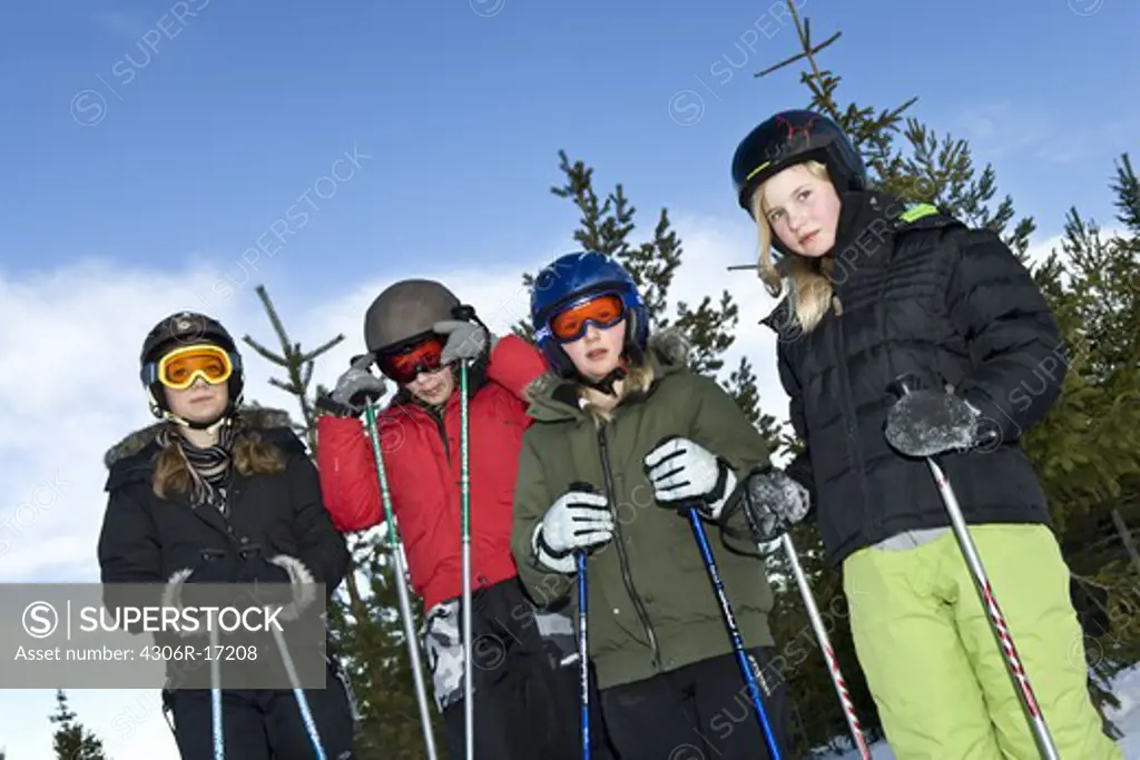 Four skiing girls ready to start, Sweden.