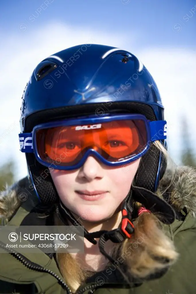 A girl wearing ski goggles Sweden.