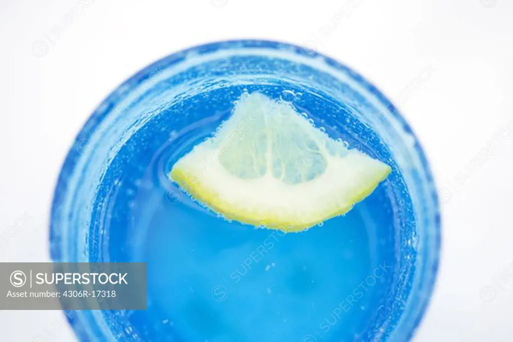 Water in a blue glass, close-up.
