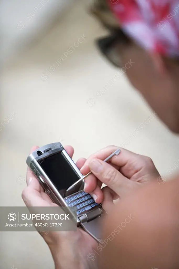 A woman using a mobile phone.