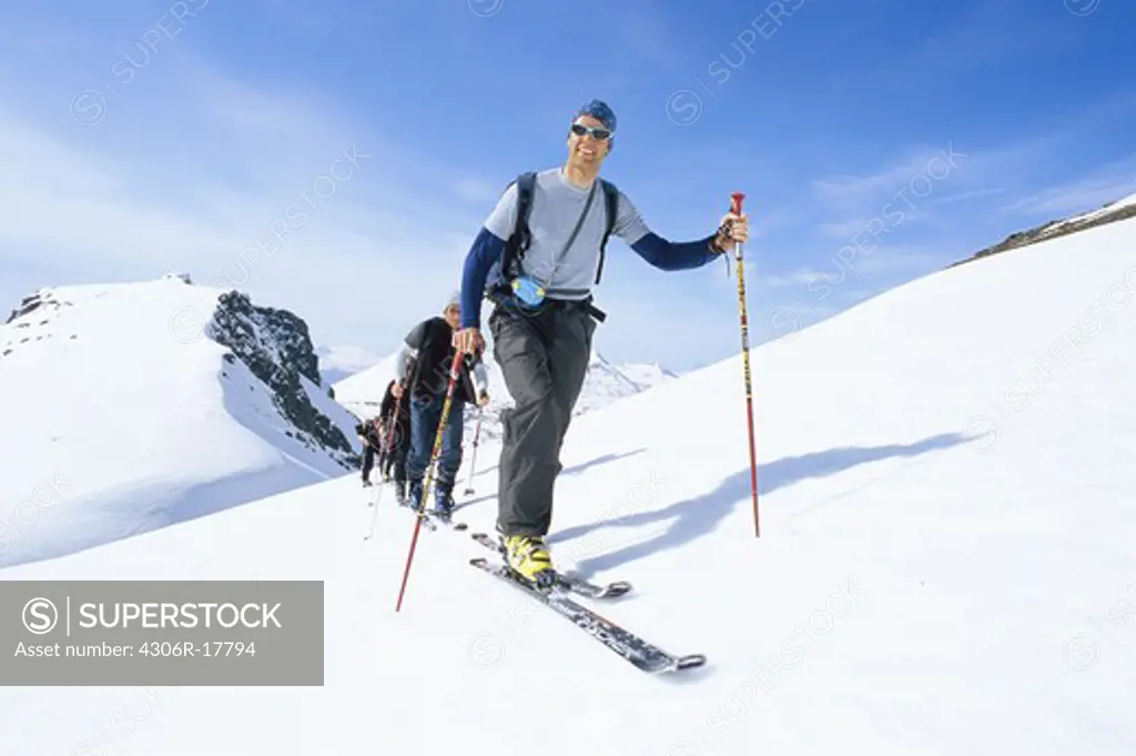 Team of skiers on mountain