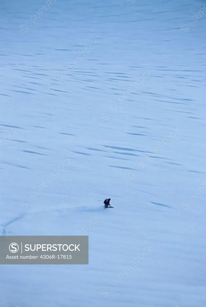 Distant view of tourist skiing