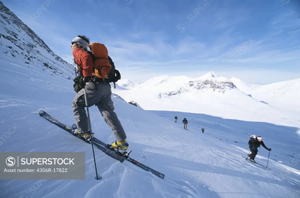 Telemark skiers in mountain scenery