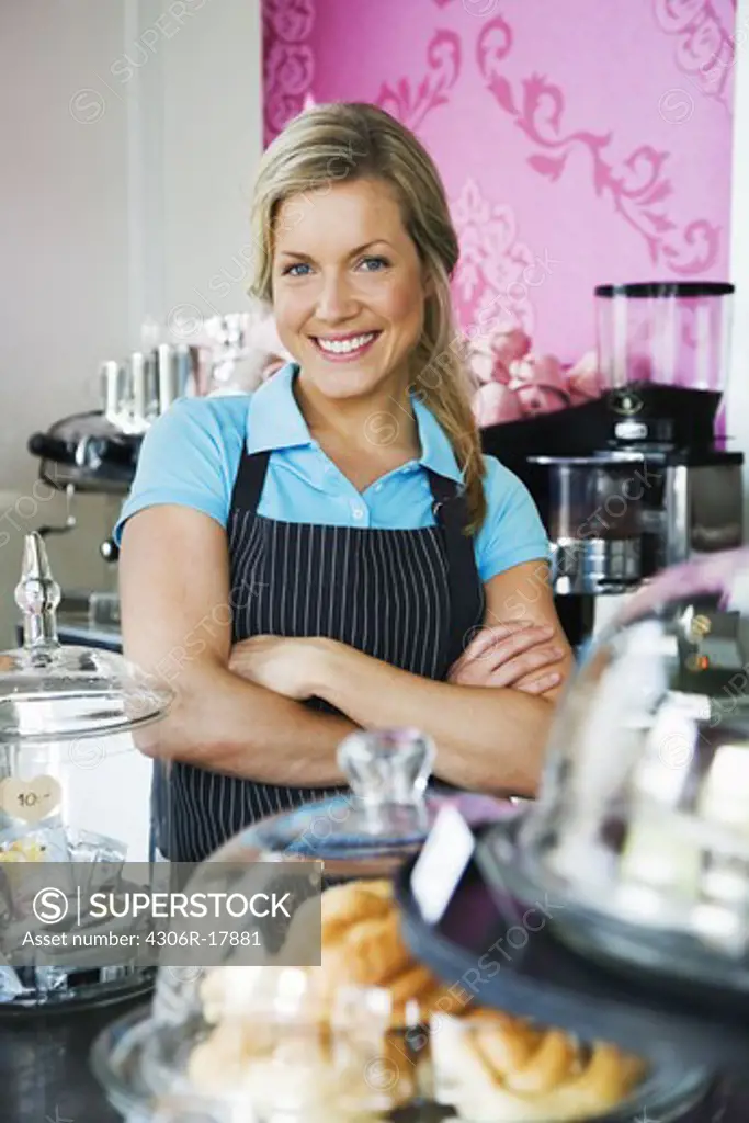 A woman working at a cafe, Sweden.
