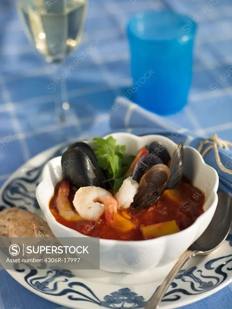 Seafood stew with bread and a glass of wine, Sweden.