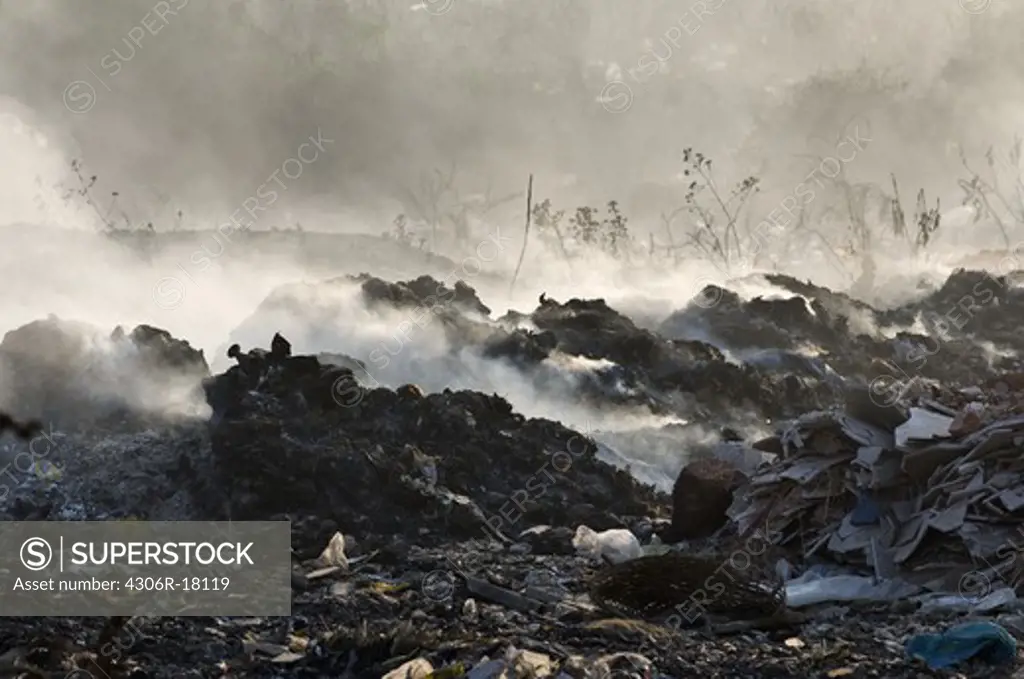 A burning garbage dump, India.