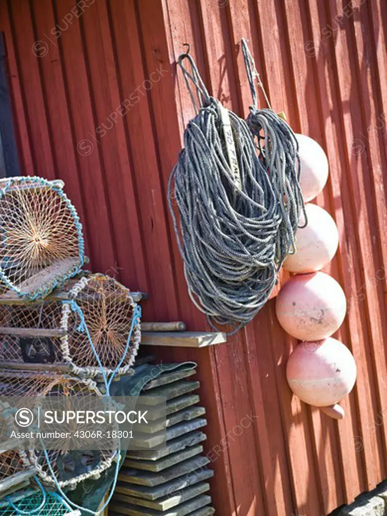 Fish traps and rope by a boathouse, Bohuslan, Sweden.