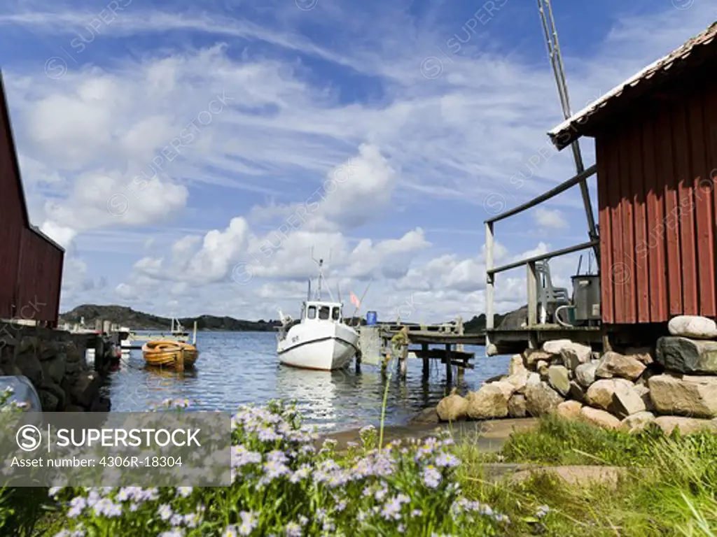 Boats moored to a jetty, Bohuslan, Sweden.