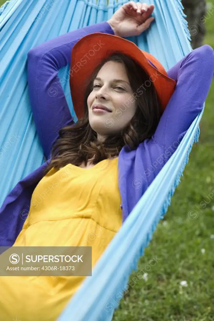 Portrait of a Scandinavian woman in a hammock.