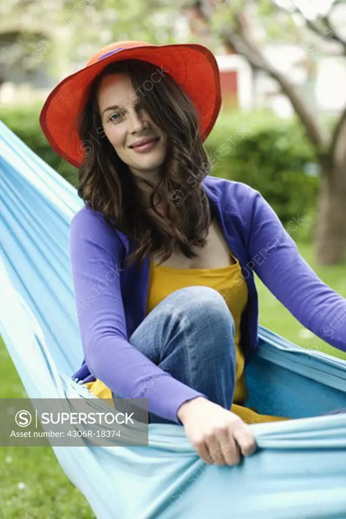 Portrait of a Scandinavian woman in a hammock.