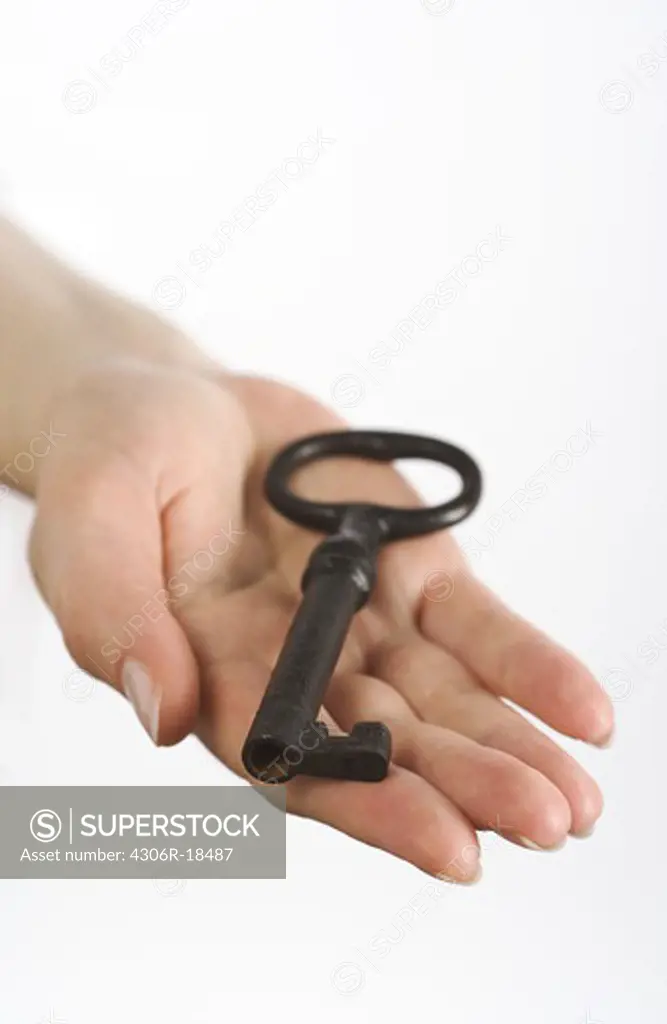 Hand holding a key, Sweden.
